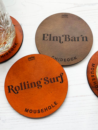 Coasters engraved with house name and village underneath