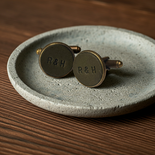 Olive green leather Bronze cufflinks with 'R&H' engraving on a textured stone plate.