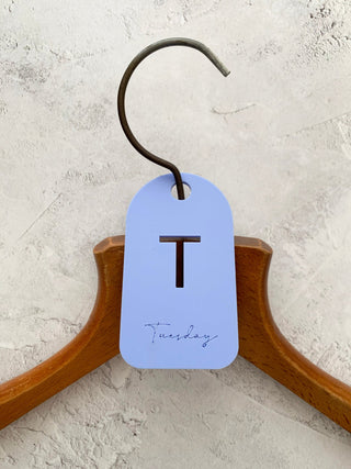 Purple tuesday hanger label on a coat hanger