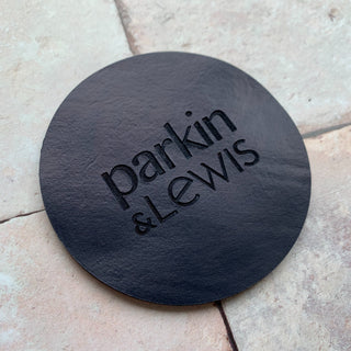 Bespoke leather coaster with your choice of logo engraved into it.