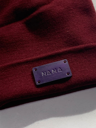 Mama text on an ox blood beanie hat