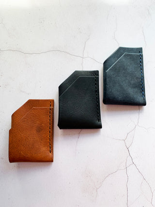 tan, black and navy leather wallet.