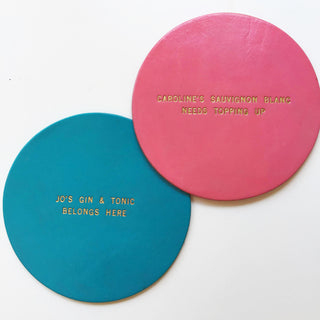 teal and hot pink painted leather coasters personalised with a favourite drink.
