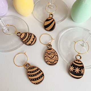 Wooden laser engraved detailed easter eggs glass charms. Available in sets of 4,6,8,10 or two, each egg will be different in each set.
