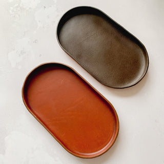 Tan Leather Pill Shape Valet Tray and Catch all Leather tray. Gorgeous entrance way gift or bedside table storage