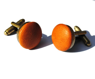 Tan leather cufflinks add a pop of colour to suit or smart-casual outfit