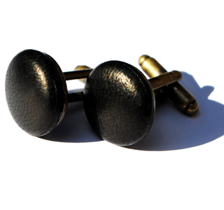 Black leather cufflinks. Understated detail to add a touch of elegance to a dress suit or dinner jacket